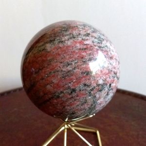Rhodocrosite crystal sphere. 550g. 2.8" width. 9" circumference.